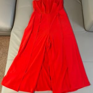 Strapless red jump suit, it looks like a dress from the back. Used but like new